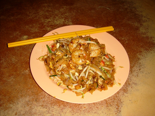 Char kway teow with flat rice noodles, prawns, cockles, egg and bean sprouts.